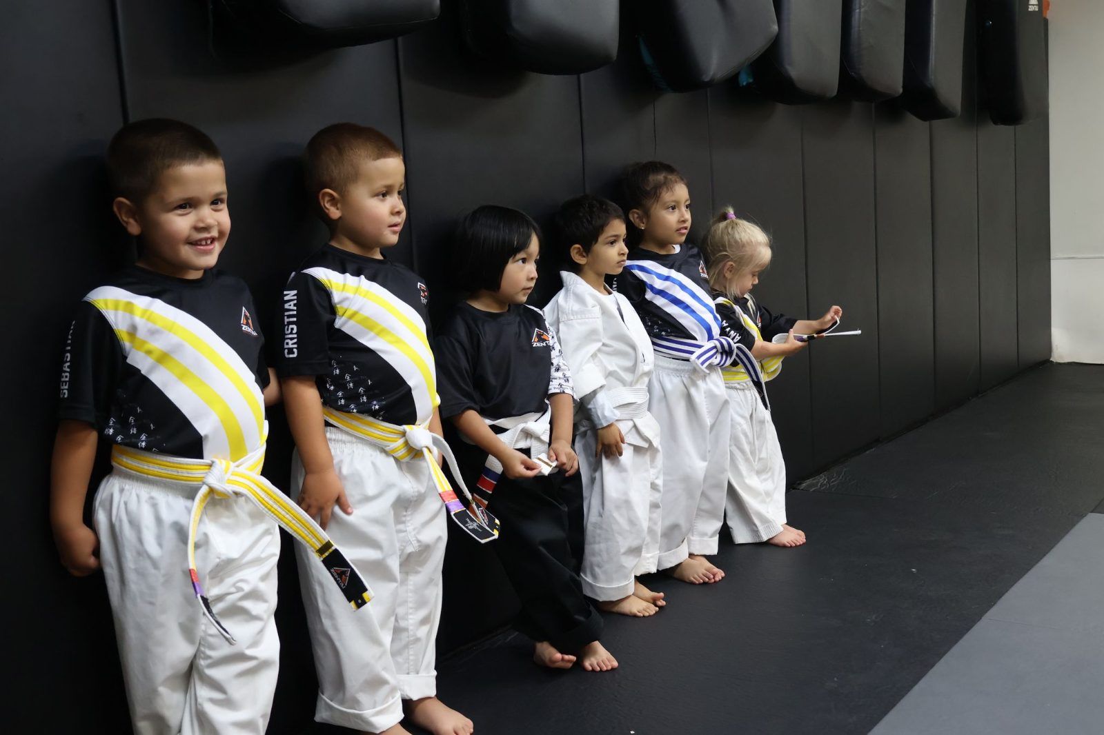 Preschoolers lined up in uniforms, smiling at ZENTAI Martial Arts in North Arlington, NJ