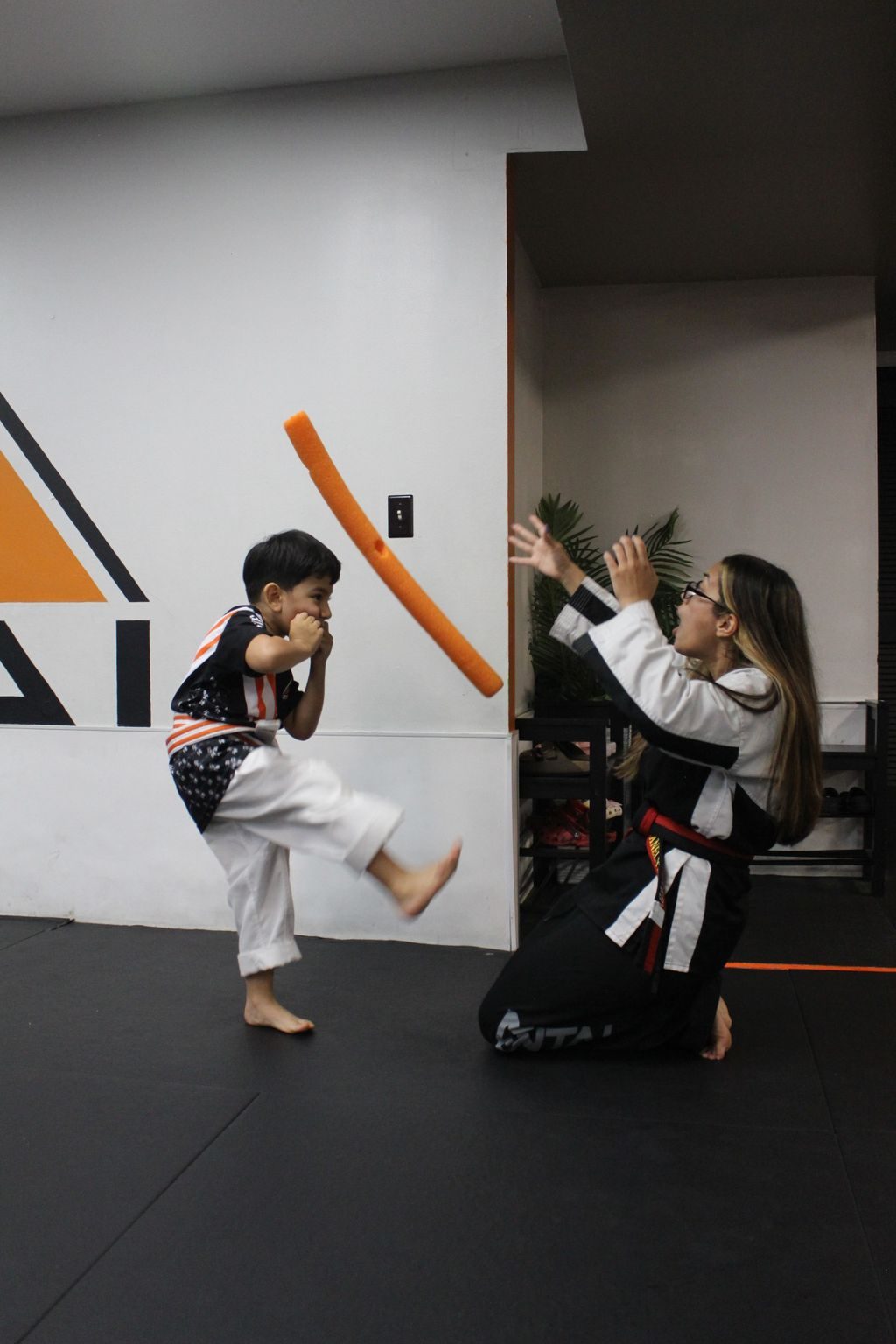 Little boy kicking a foam target at ZENTAI Martial Arts in North Arlington, NJ