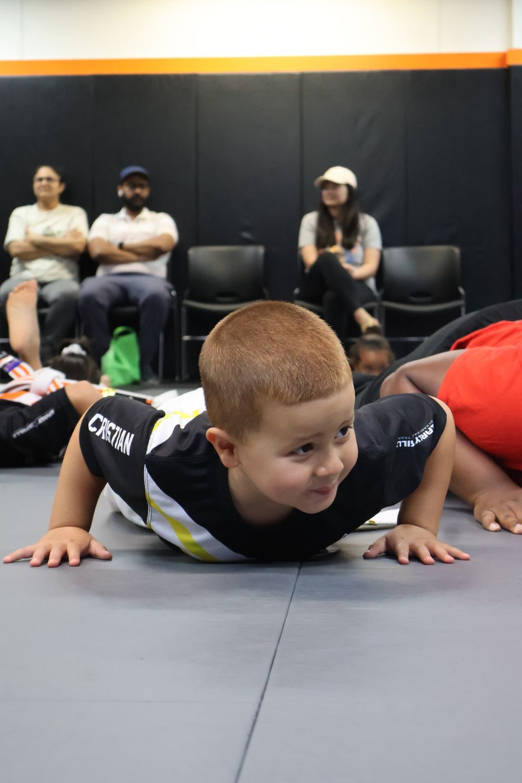 Smiling little boy in a crawling drill at ZENTAI Martial Arts in North Arlington, NJ