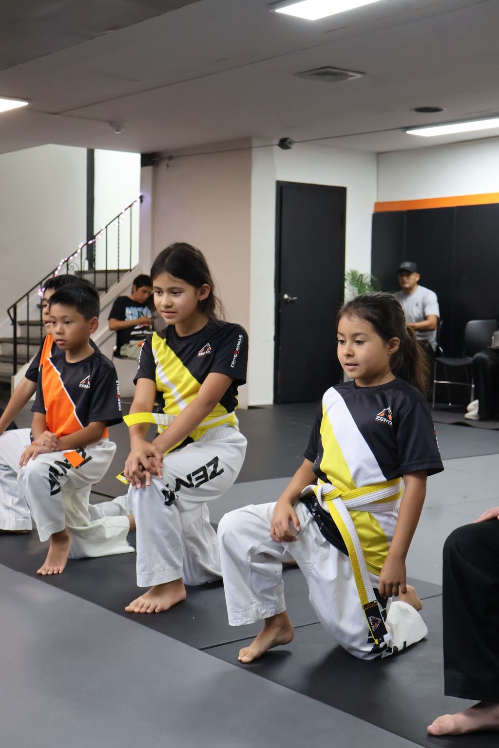 Kids sitting together laughing at ZENTAI Martial Arts in North Arlington, NJ