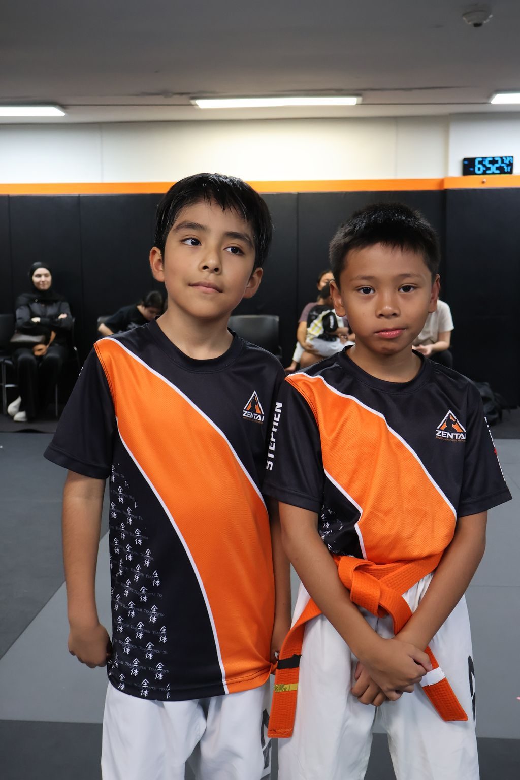 Two boys smiling side by side at ZENTAI Martial Arts in North Arlington, NJ