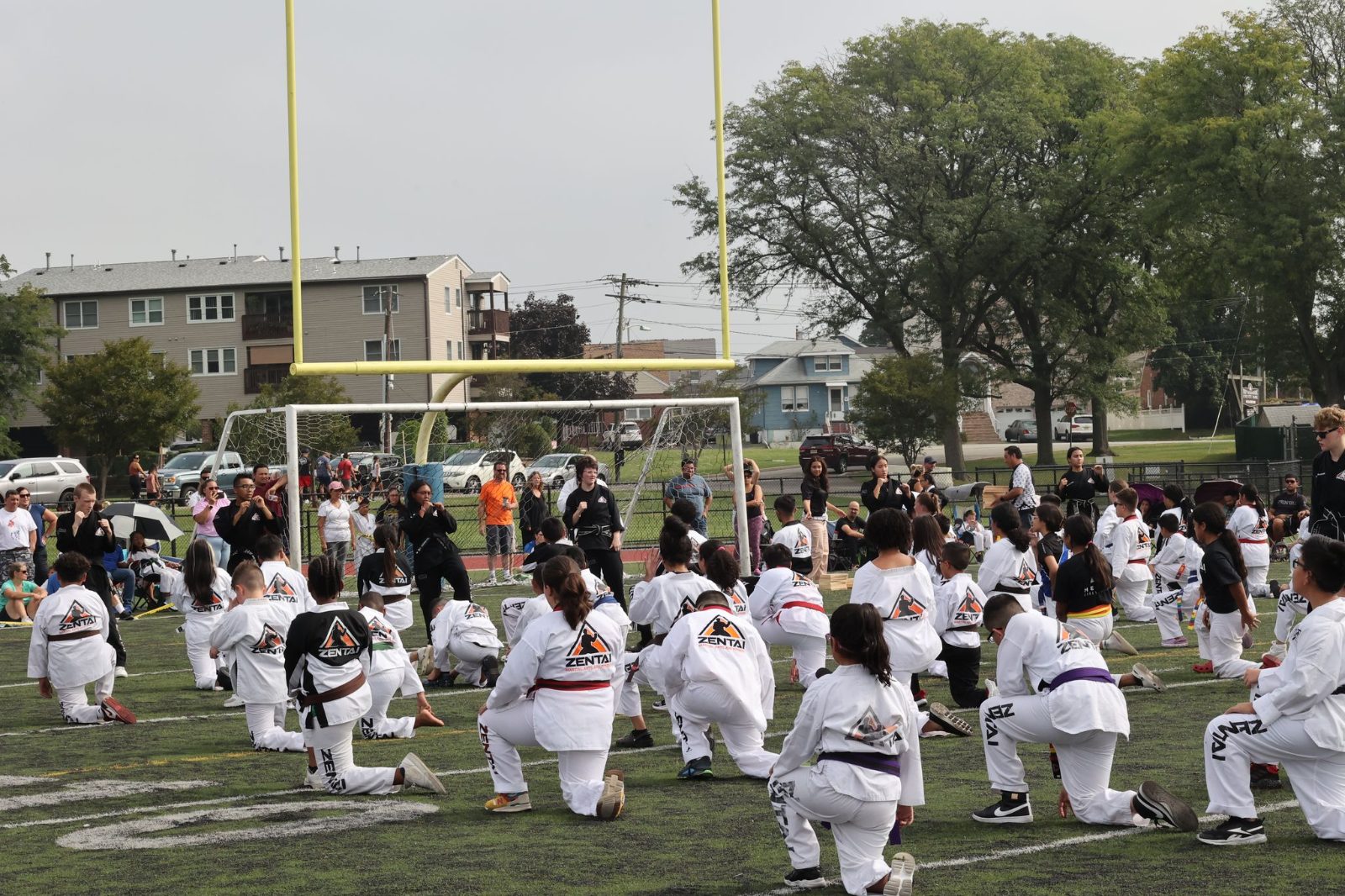 Rows of students on the field at the ZENTAI Mega Belt Promotion in New Jersey