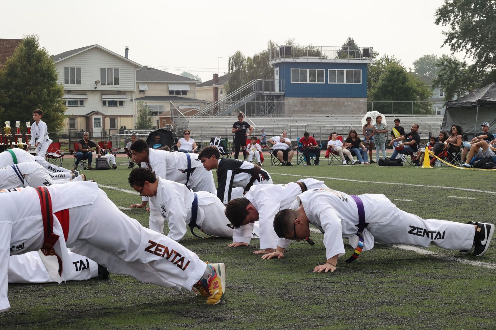 Students doing push-ups in a line at the ZENTAI Mega Belt Promotion in New Jersey