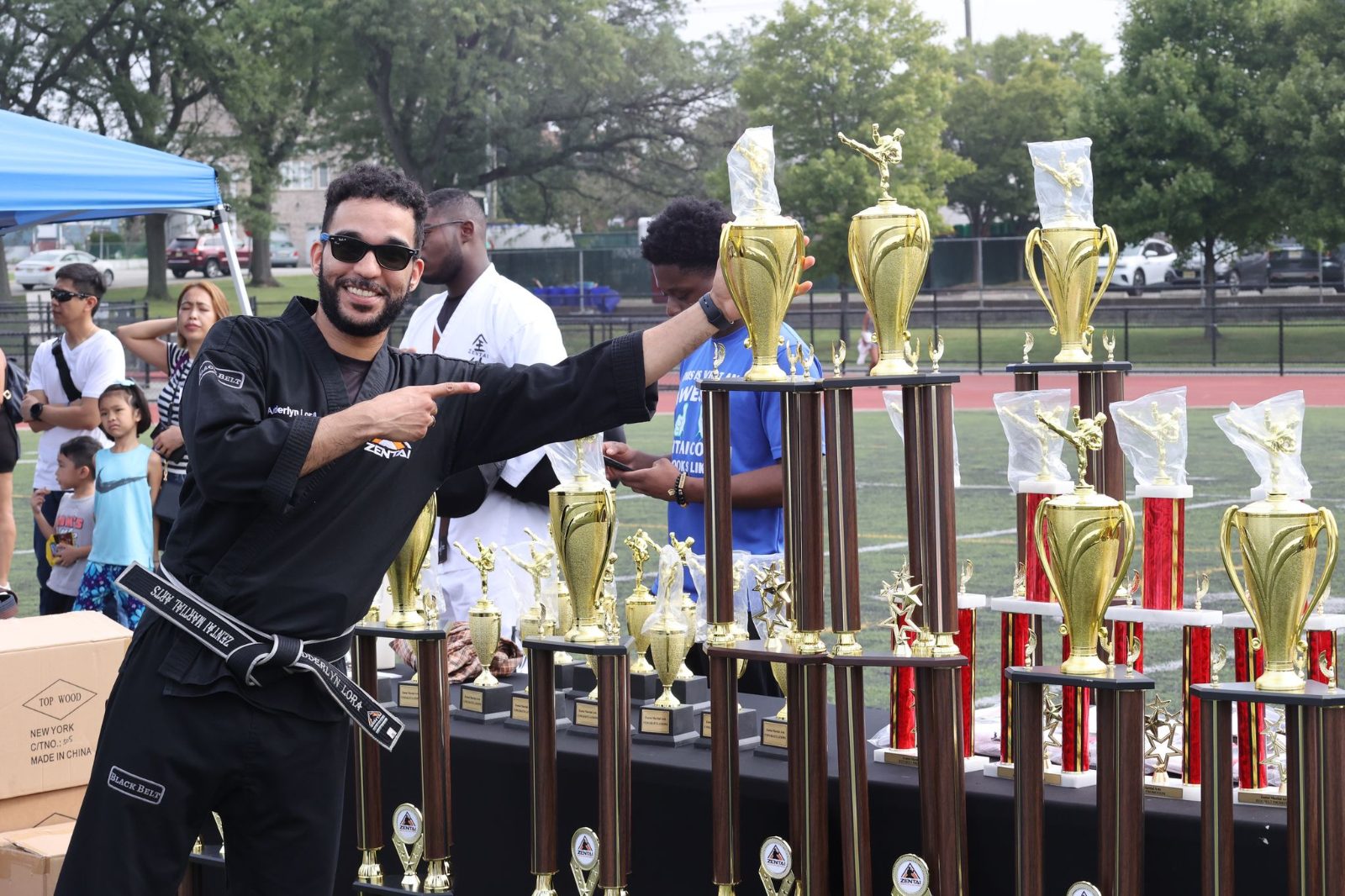 Grandmaster Allen with student trophies at the ZENTAI Mega Belt Promotion in New Jersey
