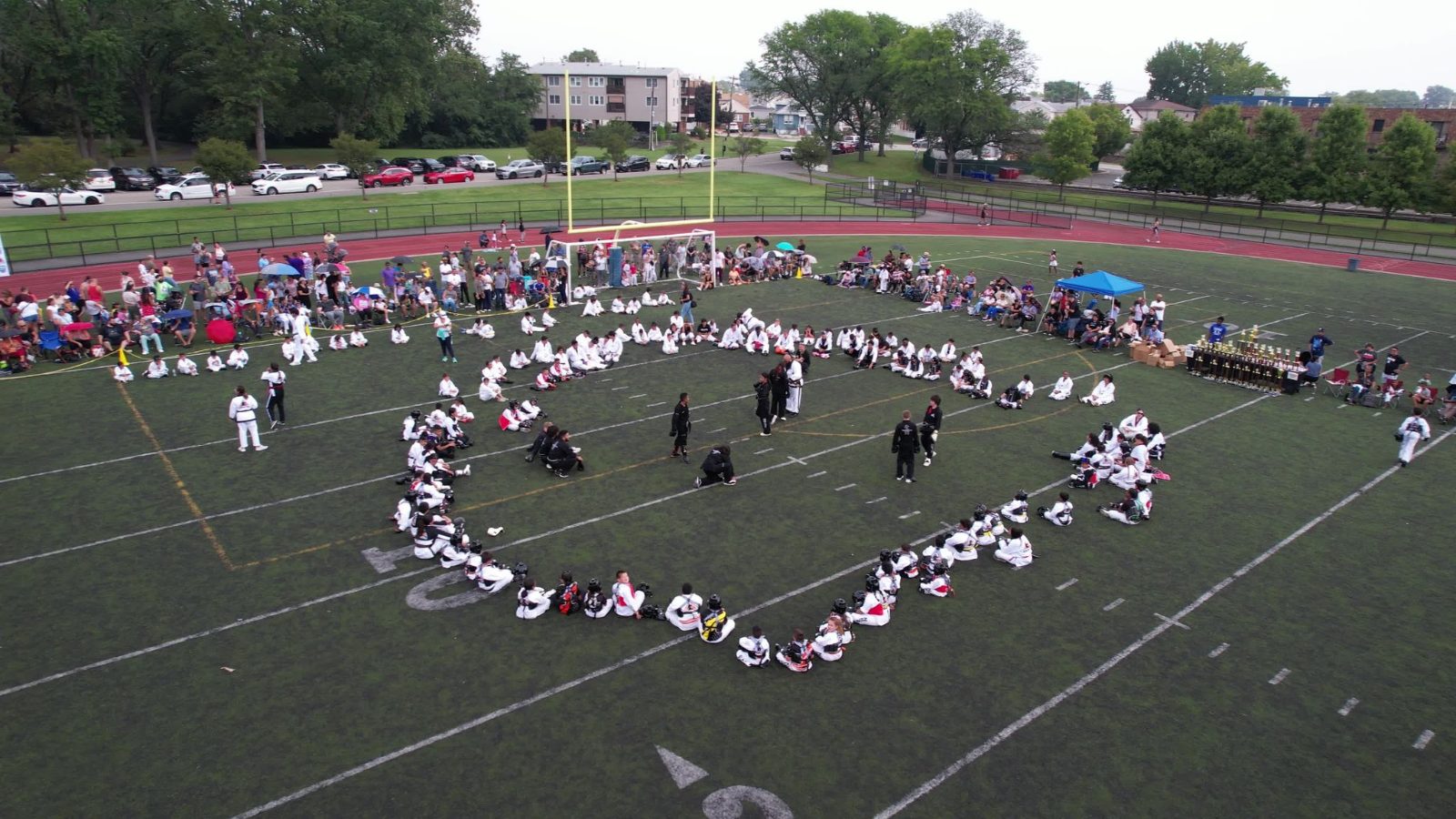 Aerial view of students forming a heart on the field at the ZENTAI Mega Belt Promotion in New Jersey