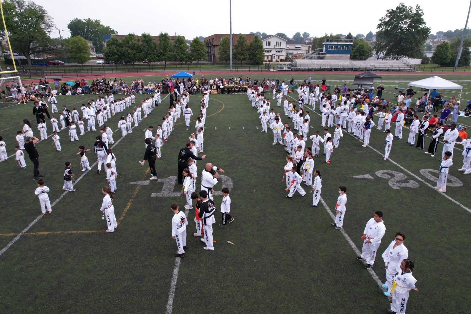 Students lined up in rows, seen from above at the ZENTAI Mega Belt Promotion in New Jersey