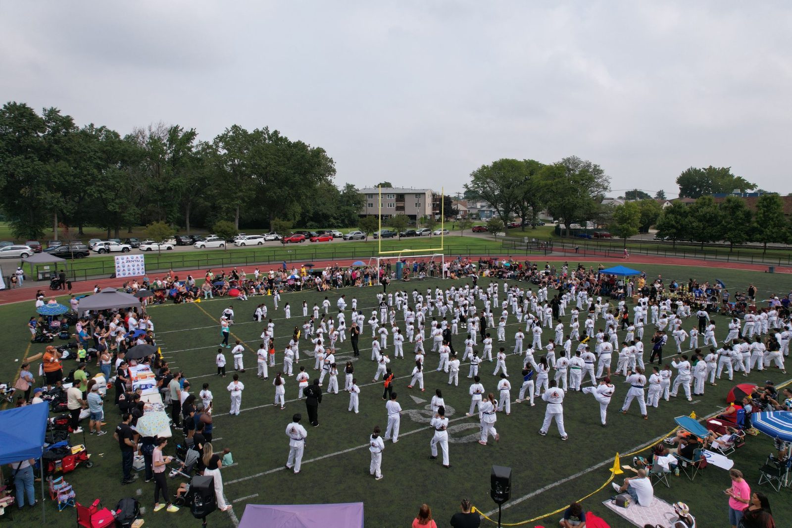 A huge group of students in rows, seen from above at the ZENTAI Mega Belt Promotion in New Jersey