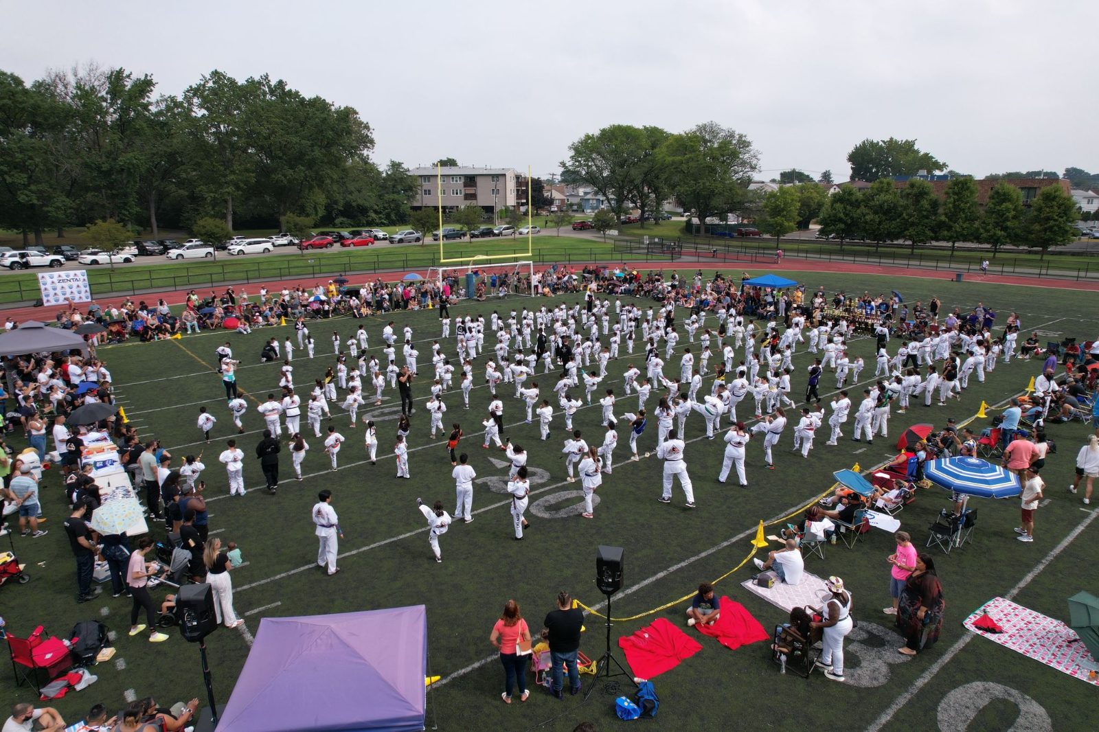 Students and families across the field, seen from above at the ZENTAI Mega Belt Promotion in New Jersey