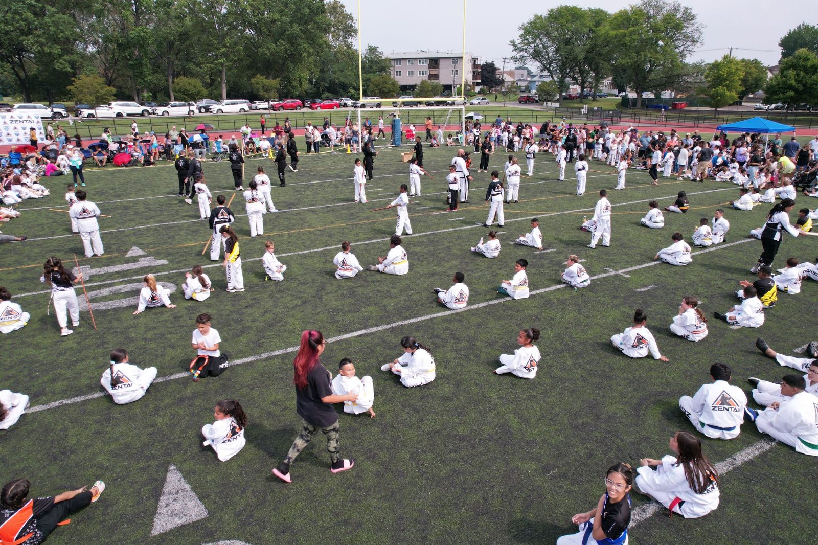 Students practicing together across the field at the ZENTAI Mega Belt Promotion in New Jersey