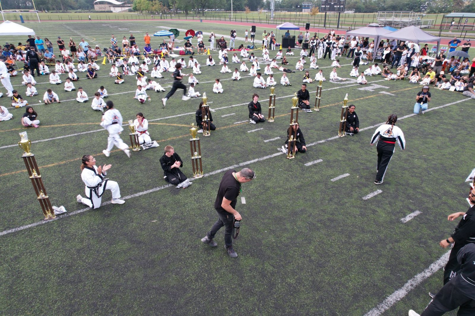 Students moving across the field together at the ZENTAI Mega Belt Promotion in New Jersey