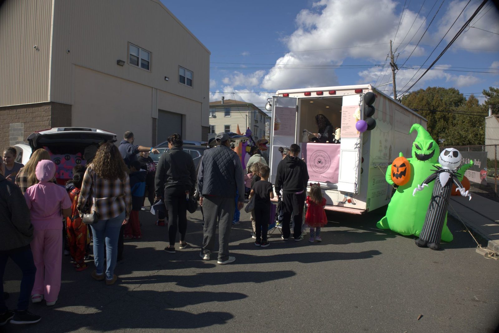 Families in costumes at the ZENTAI Fall Fest