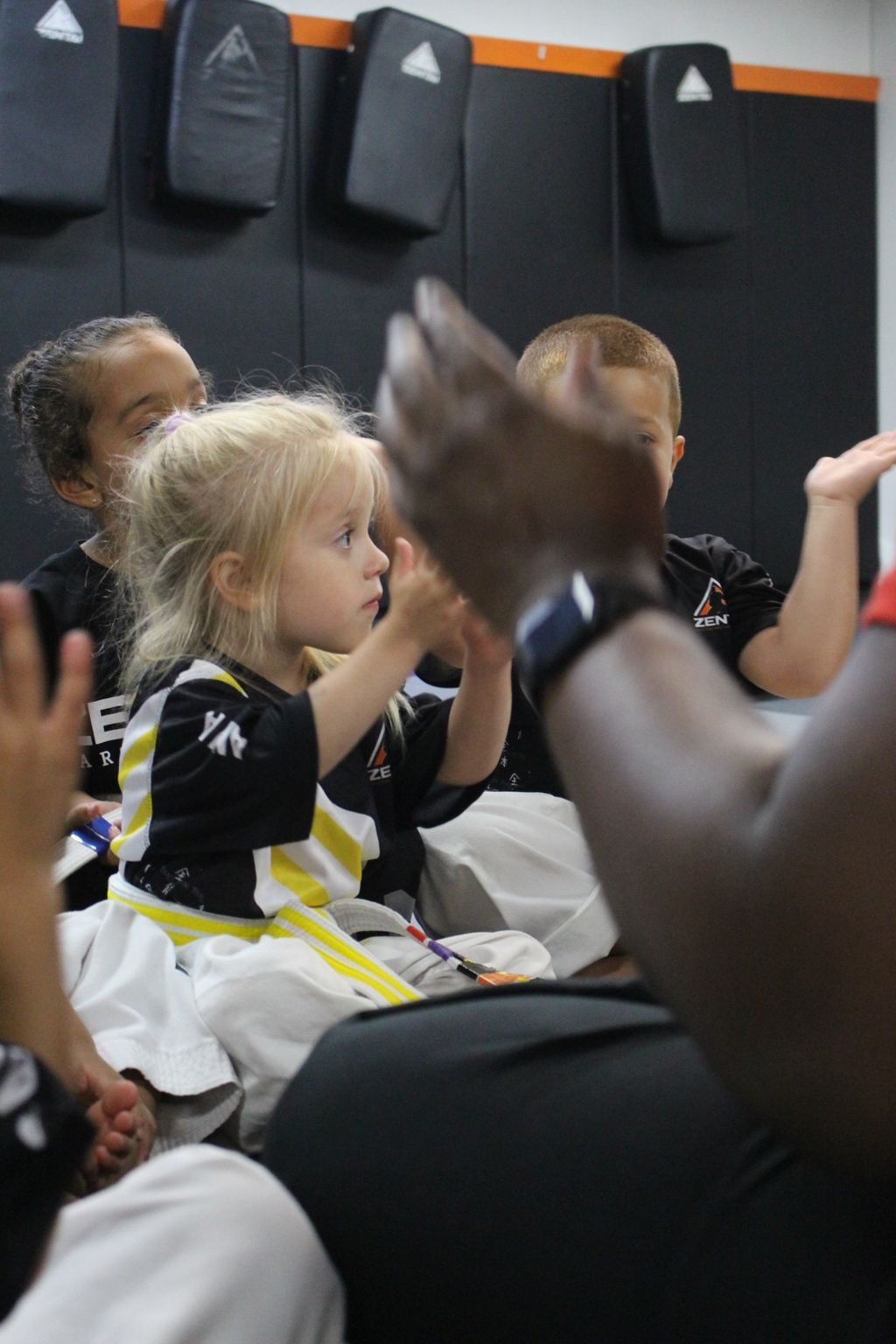 Little girl clapping in class at ZENTAI Martial Arts in North Arlington, NJ