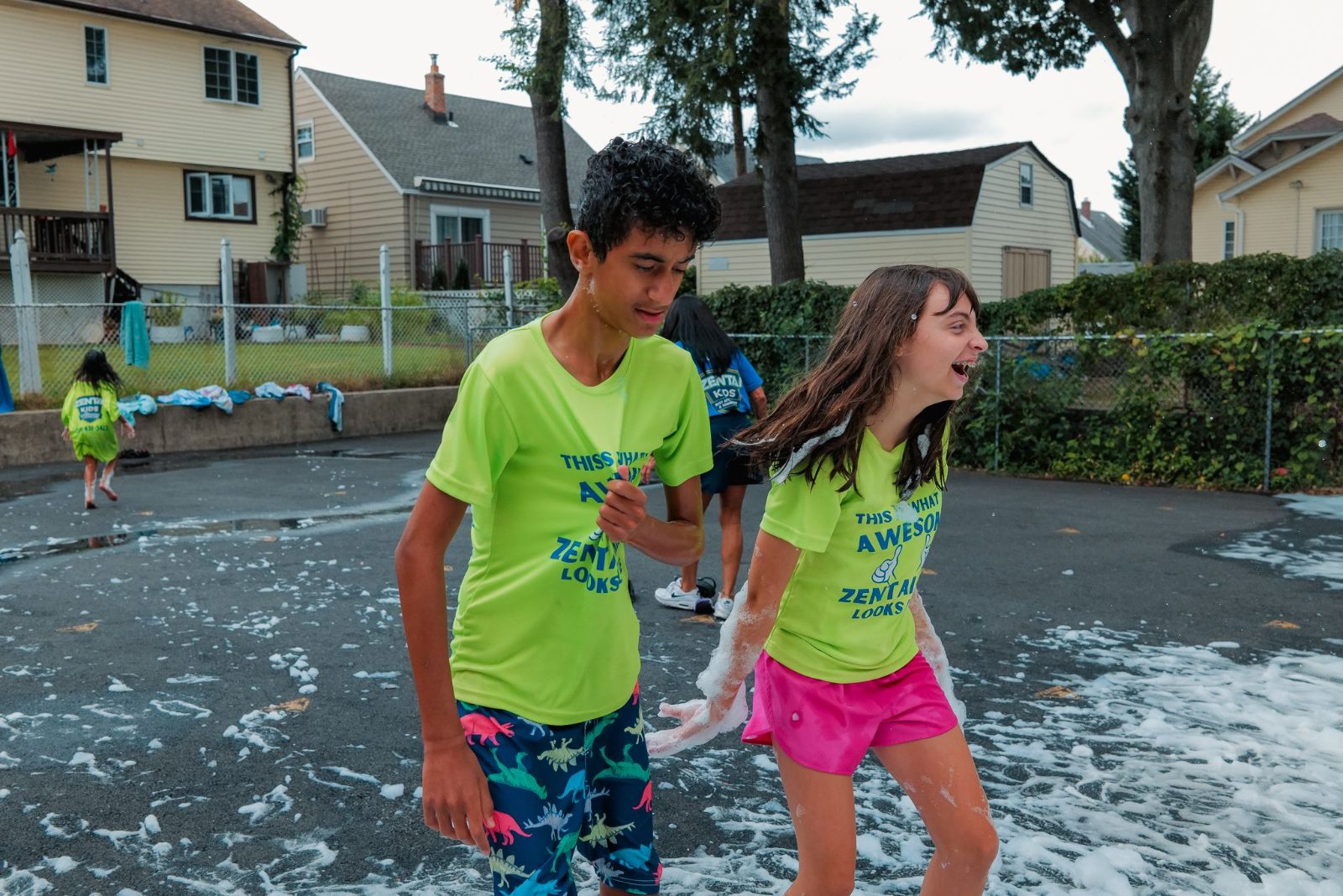 Kids running and playing outdoors at ZENTAI summer camp in New Jersey