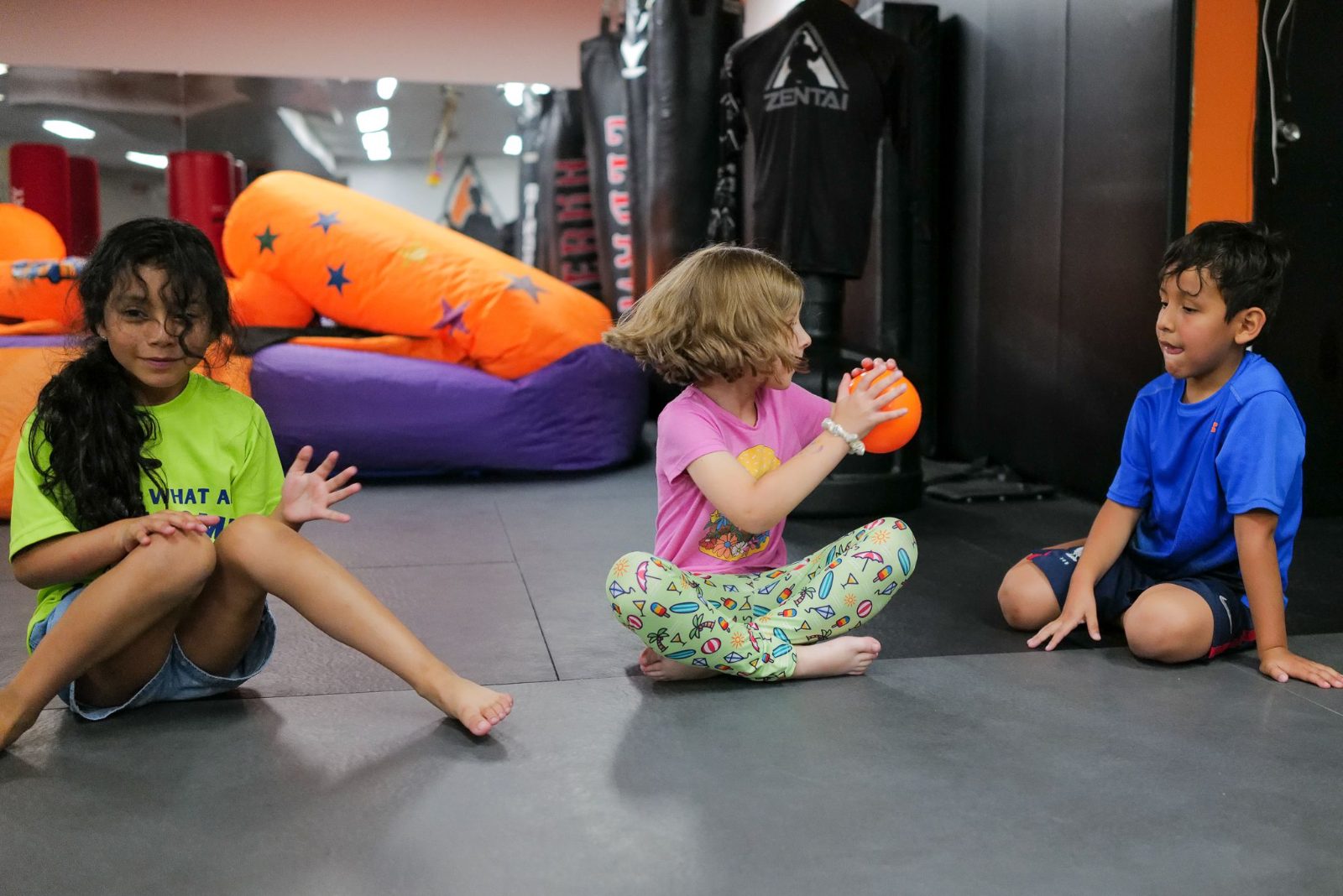 Kids playing with balls on the mat at ZENTAI summer camp in New Jersey