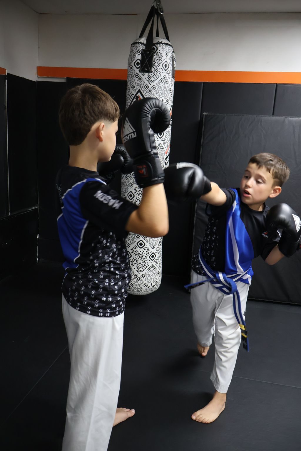 Kids practicing at the heavy bag at ZENTAI Martial Arts in North Arlington, NJ