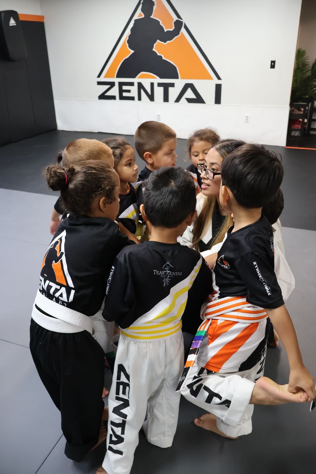 Kids huddled together in class at ZENTAI Martial Arts in North Arlington, NJ