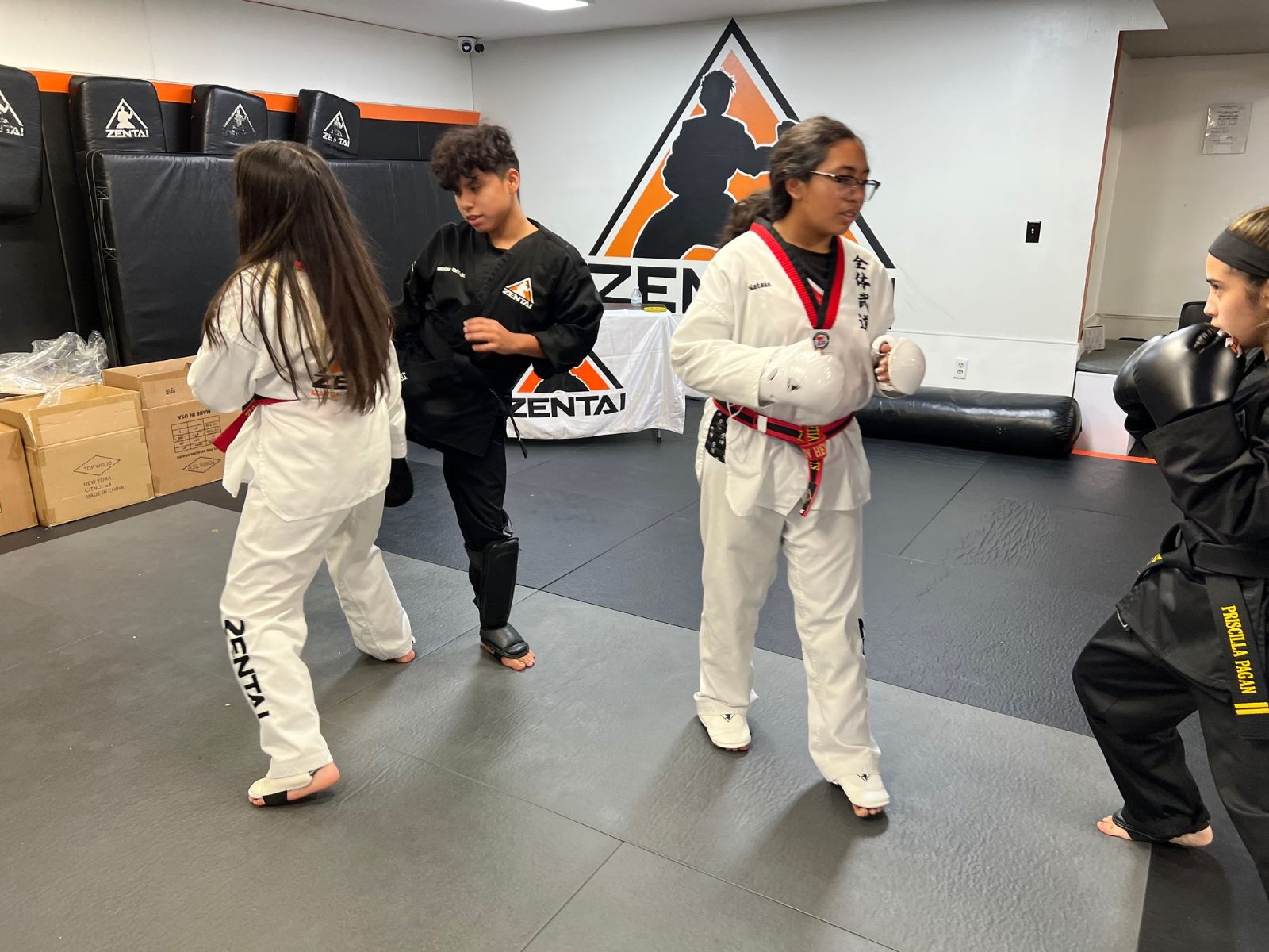 Teens practicing kicks in class at ZENTAI Martial Arts in New Jersey