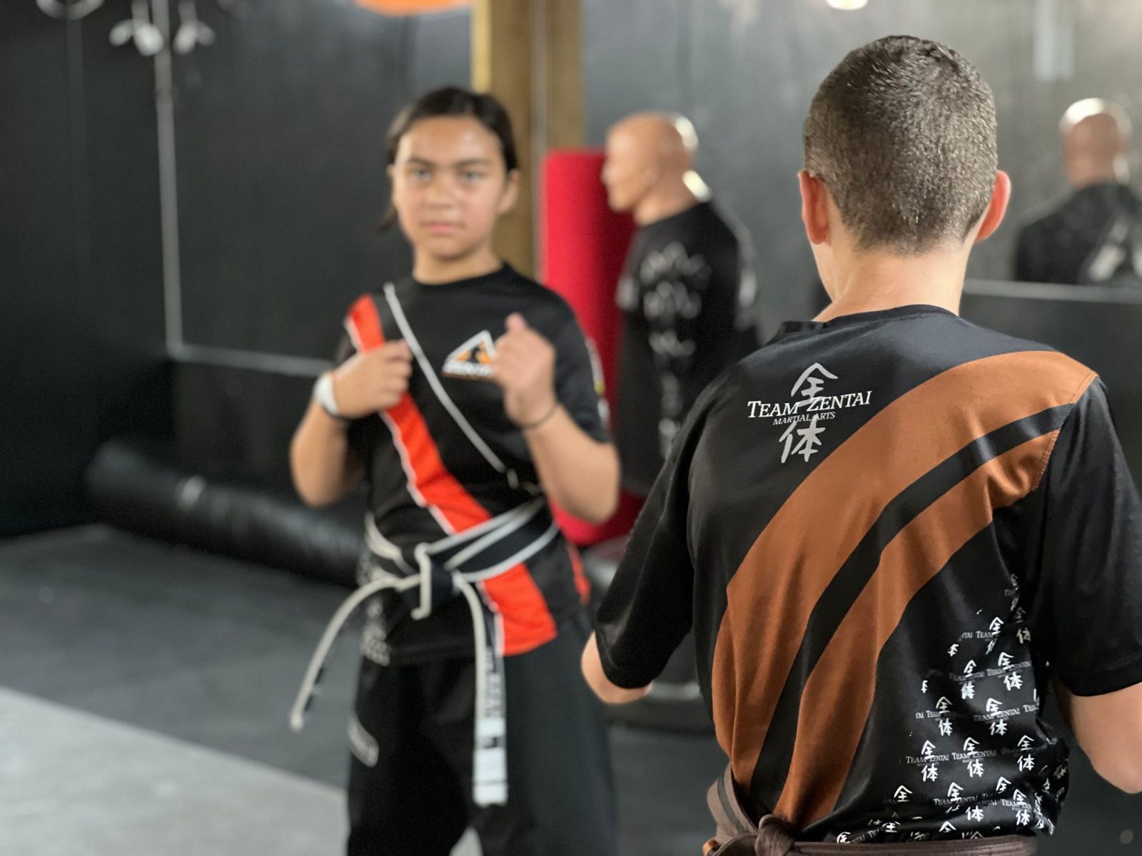 Teen girl training with an instructor at ZENTAI Martial Arts in New Jersey